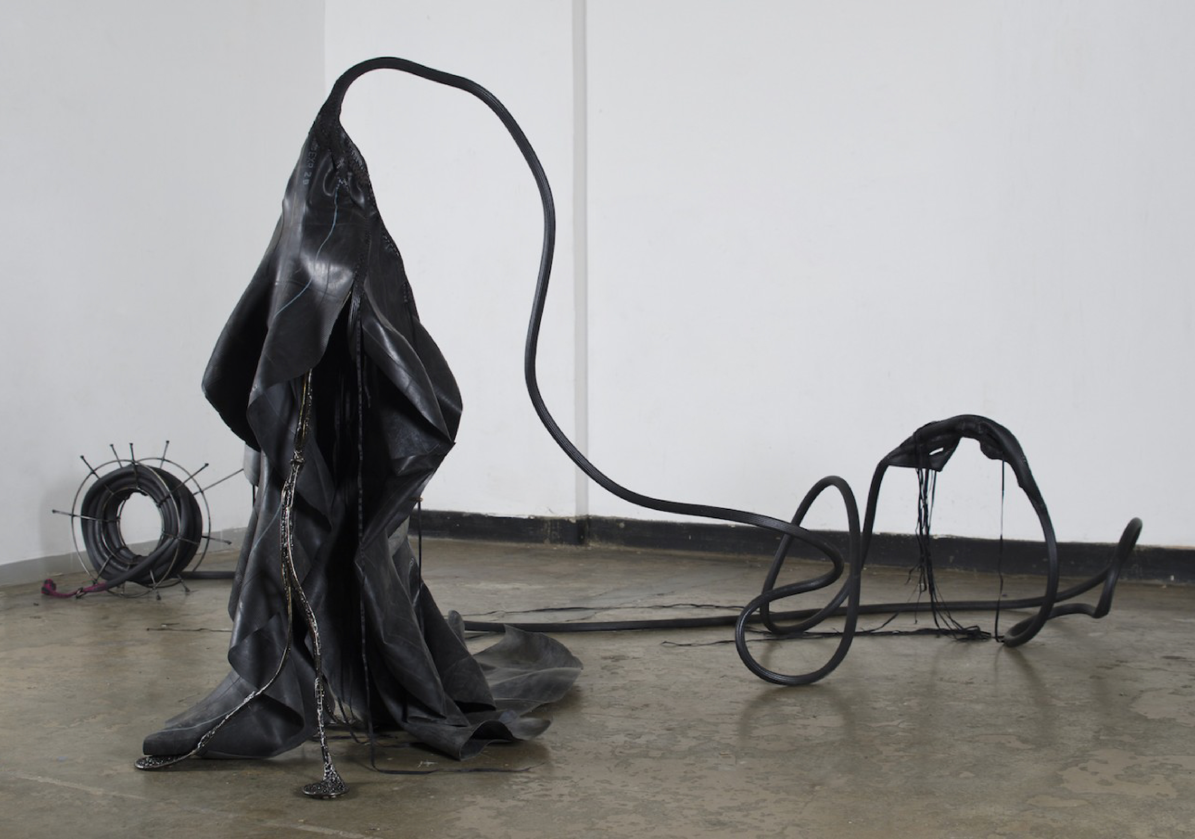 Nicholas Hlobo, Balindile III, 2012. Inner rubber tube, ribbons, canvas, hosepipe and steel